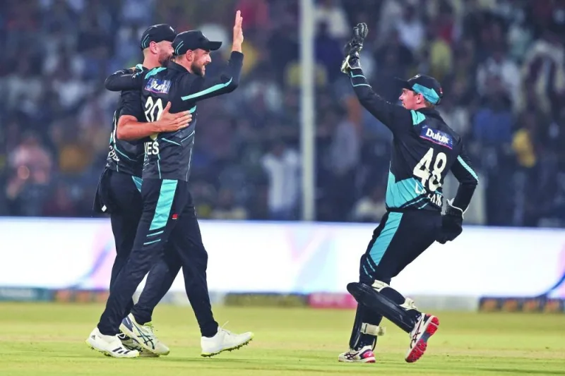 New Zealand’s captain Tom Latham (right) celebrates after the dismissal of Pakistan’s Mohamed Rizwan during the third Twenty20 international in Lahore on Monday. (AFP)