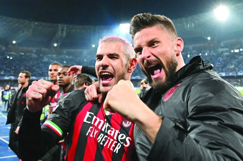 AC Milan’s Olivier Giroud (right) and Theo Hernandez celebrate after their win over Napoli in the Champions League quarter-finals. (AFP)
