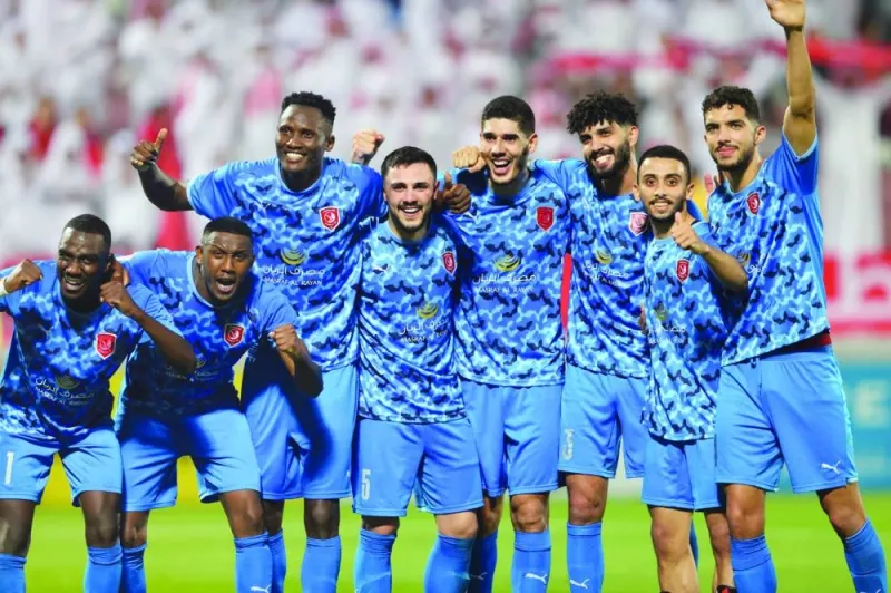 Al Duhail players celebrate after their win over Al Rayyan on Tuesday night.