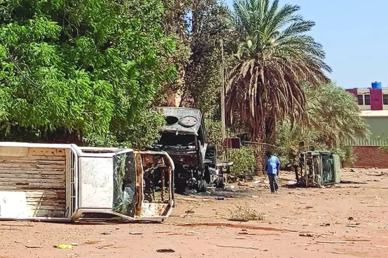 A man inspects destroyed vehicles outside the headquarter of the Rapid Support Forces (RSF) paramilitaries in southern Khartoum yesterday amid fighting between Sudan’s regular army and paramilitaries following the collapse of a 24-hour truce.
