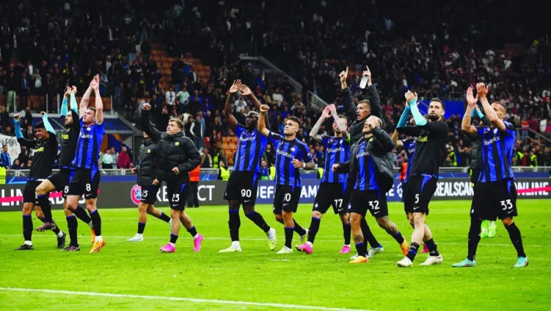 Inter Milan players celebrate after their win over Benfica in the Champions League quarter-finals in Milan. (Reuters