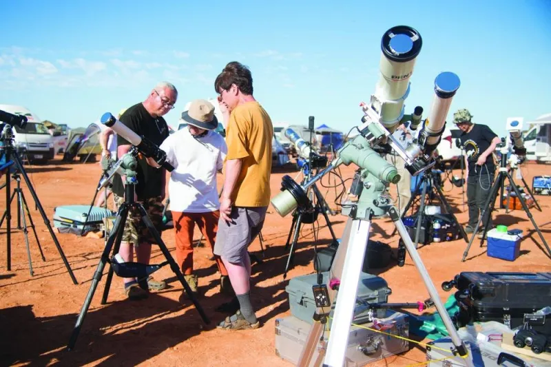 People gather to watch a total solar eclipse at a viewing site 35km from Exmouth, Western Australia.