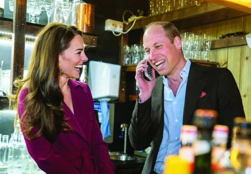 William and Catherine take a booking from a member of the public during a visit to The Indian Streatery in Birmingham.
