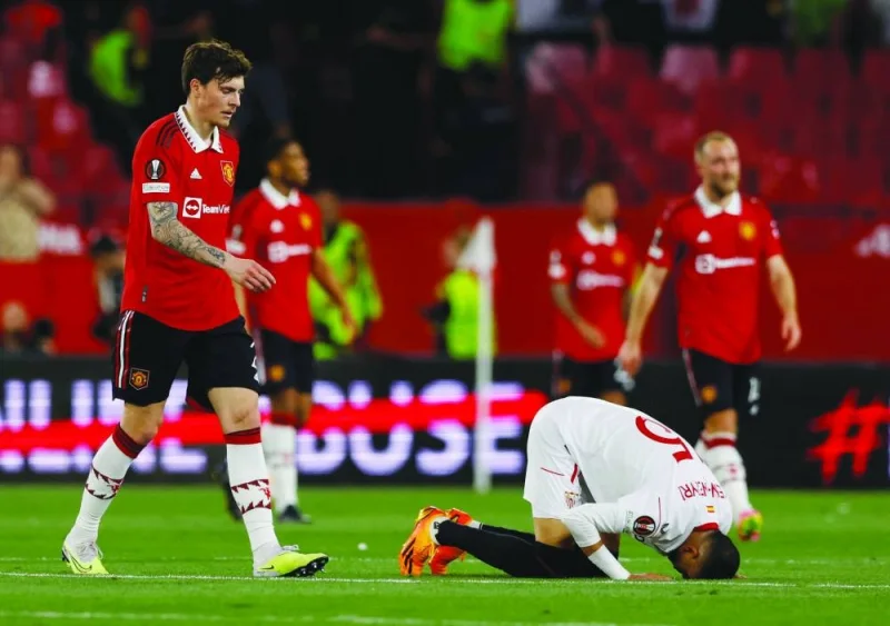Sevilla’s Youssef En-Nesyri reacts as Manchester United’s Victor Lindelof (left) looks dejected after the Europa League second leg quarter-final at the Ramon Sanchez Pizjuan in Seville, Spain, on Thursday. (Reuters)