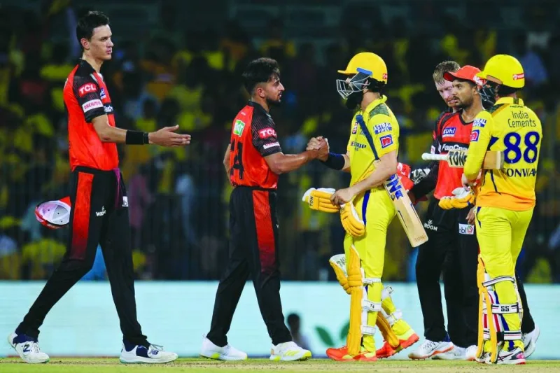 Chennai Super Kings’ Moeen Ali (third from left) and Devon Conway (right) greet Sunrisers Hyderabad’s players at the end of the IPL match at the MA Chidambaram Stadium in Chennai on Friday. (AFP)