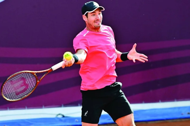 Serbia’s Dusan Lajovic plays a forehand return to Serbia’s Novak Djokovic during their quarter-final at Sprska Tennis Open in Banja Luka on Friday. (AFP)