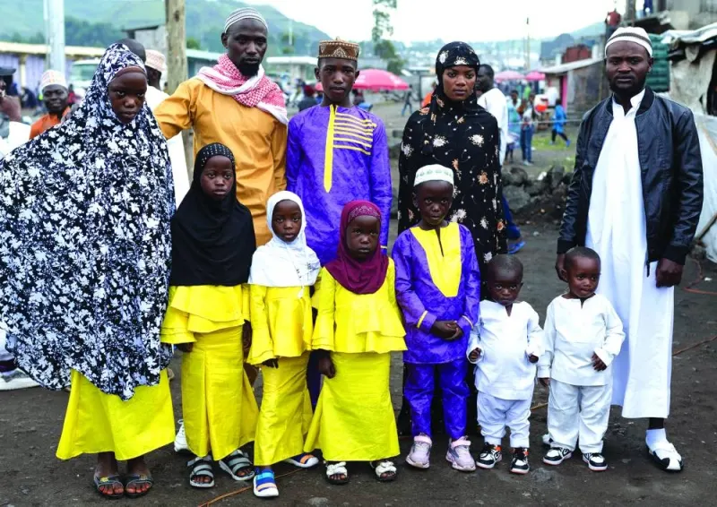Members of an internally displaced Congolese family pose for a photograph during Eid al-Fitr celebrations in the Munigi camp site near Goma in the North Kivu province of the Democratic Republic of Congo.