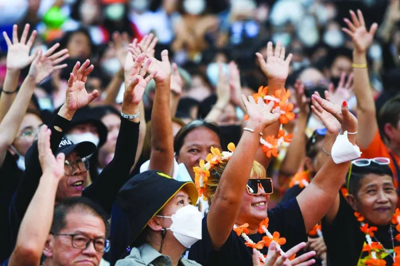 Move Forward Party supporters attend an upcoming election campaign event in Bangkok.