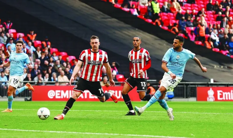 Manchester City’s Riyad Mahrez scores against Sheffield United during the FA Cup semi-final at the Wembley Stadium. (Reuters)