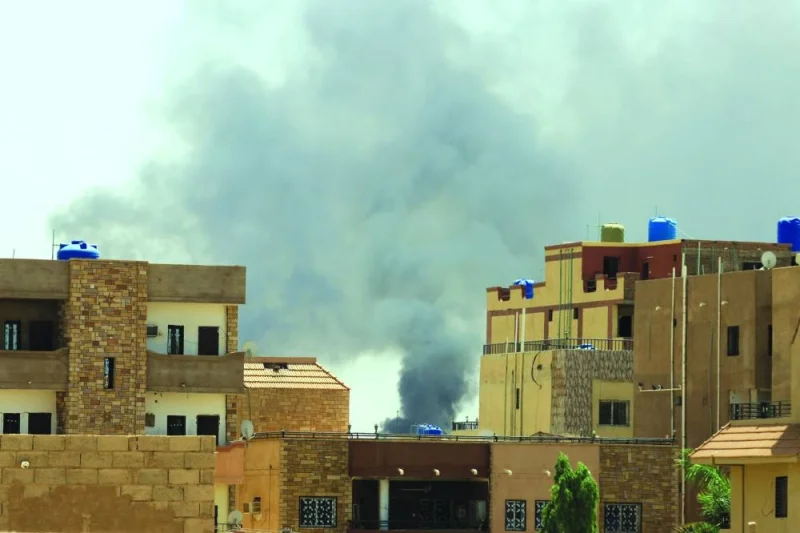 Smoke is seen rise from buildings during clashes between the paramilitary Rapid Support Forces and the army in Khartoum North, Sudan, yesterday.