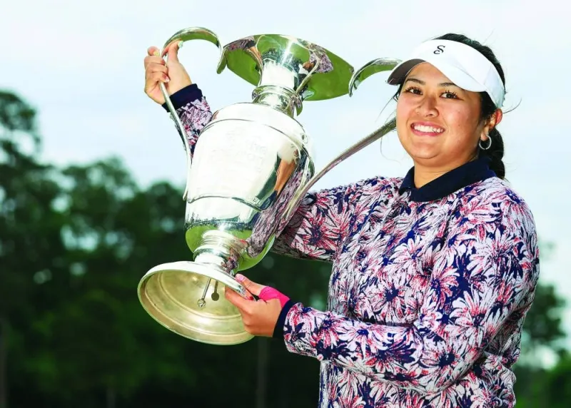 Lilia Vu of the US celebrates with the trophy after winning in a one-hole playoff during the final round of The Chevron Championship at The Club at Carlton Woods in The Woodlands, Texas. (AFP)