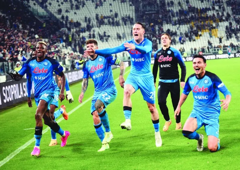 Napoli players celebrate after their win over Juventus on Sunday. (Reuters)