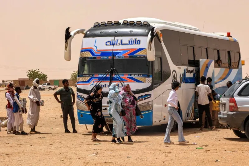 People disembark off a passenger bus at the Multaga rest-stop near Ganetti in Sudan&#039;s Northern State on April 25, 2023, about 300 kilometres northwest of the capital. AFP