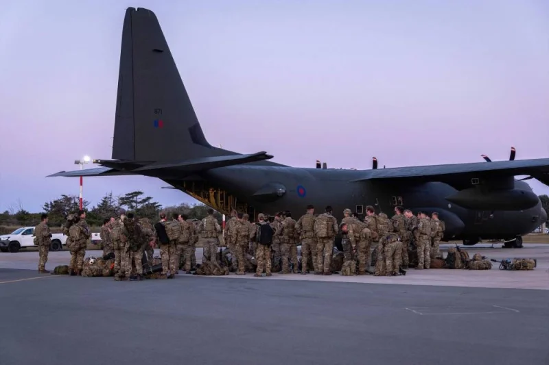 Royal Marines from 3 Commando Brigade boarding a C-130 Hercules aircraft, bound for Sudan where they will help with the evacuation of British nationals, at RAF Akrotiri in Cyprus.  AFP/ CROWN COPYRIGHT 2023 / MOD / Mark Johnson 