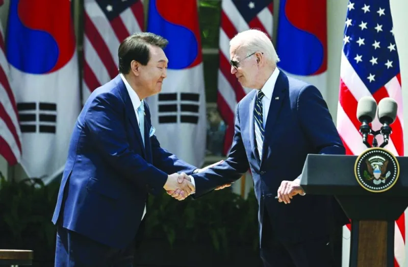US President Joe Biden and South Korean President Yoon Suk-yeol participate in a news conference in the Rose Garden of the White House in Washington, DC, on Wednesday.