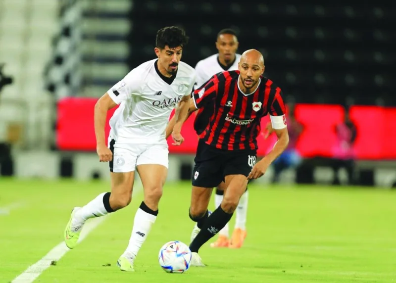 Al Sadd’s Baghdad Bounedjah (left) and Al Rayyan’s Steven Nzonzi battle for the ball during the QNB Stars League match at the Jassim Bin Hamad Stadium on Friday.  