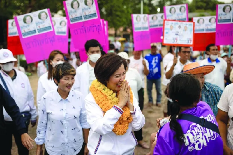 Treenuch Thienthong (centre), education minister and local candidate in the upcoming general election, arriving for a Palang Pracharath Party campaign rally in the Thai province of Sa Kaeo.