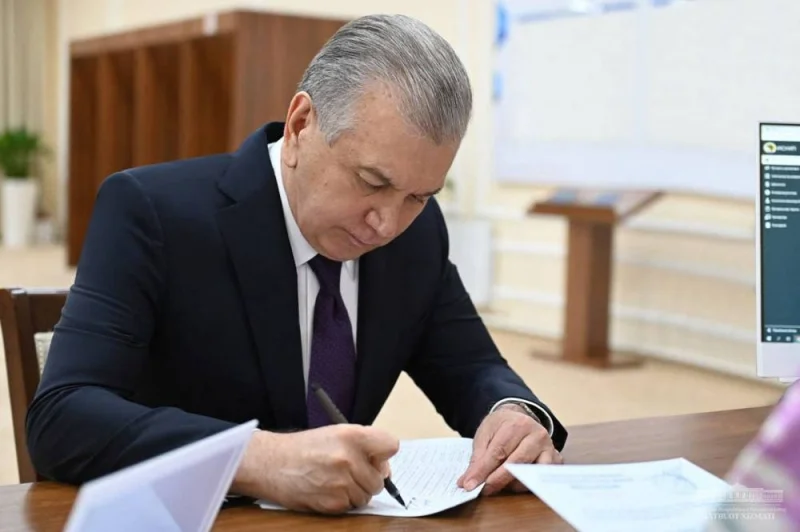 Uzbek President Shavkat Mirziyoyev visiting a polling station in Tashkent on the election day. (AFP)