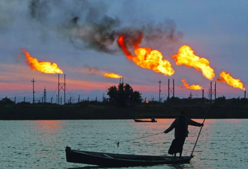 Flames emerge from flare stacks at the oil fields in Basra, Iraq. Opec and its allies have announced new production cutbacks starting this month to shore up global oil markets, but the biggest supply changes in April were unintentional. Iraq accounted for about 80% of the drop.