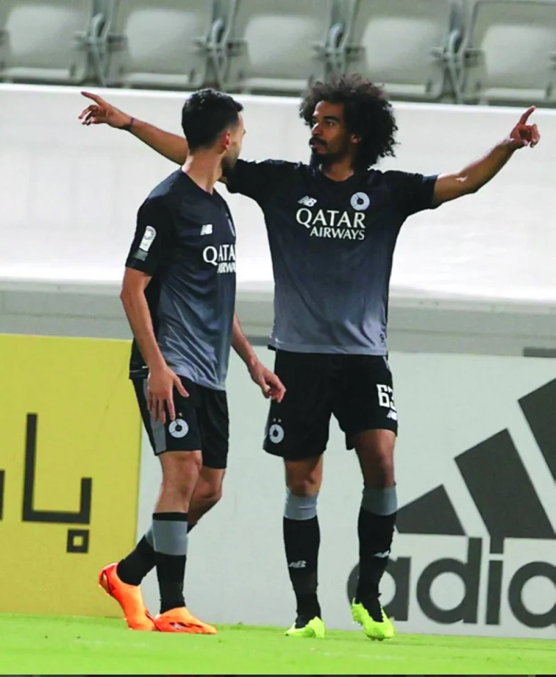Al Sadd’s Akram Afif (right) celebrates with teammate after scoring against Al Duhail in their QNB Stars League match on Thursday.