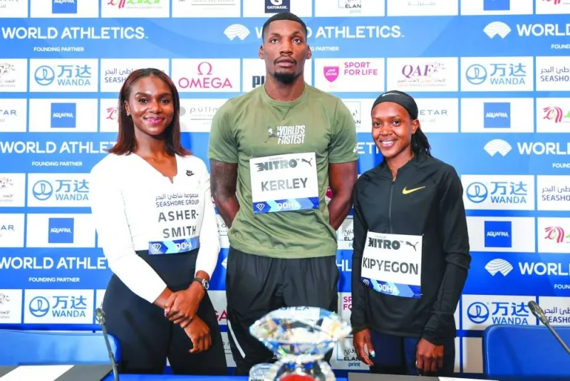 Dina Asher-Smith (left) of Britain, Fred Kerley (centre) of the United States and Faith Kipyegon of Kenya pose after the press conference in Doha on Thursday. PICTURES: Noushad Thekkayil