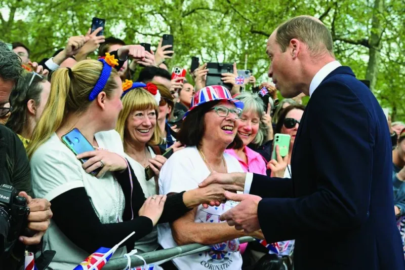 
Prince William meets well-wishers during a walkabout on the Mall outside Buckingham Palace in London. 