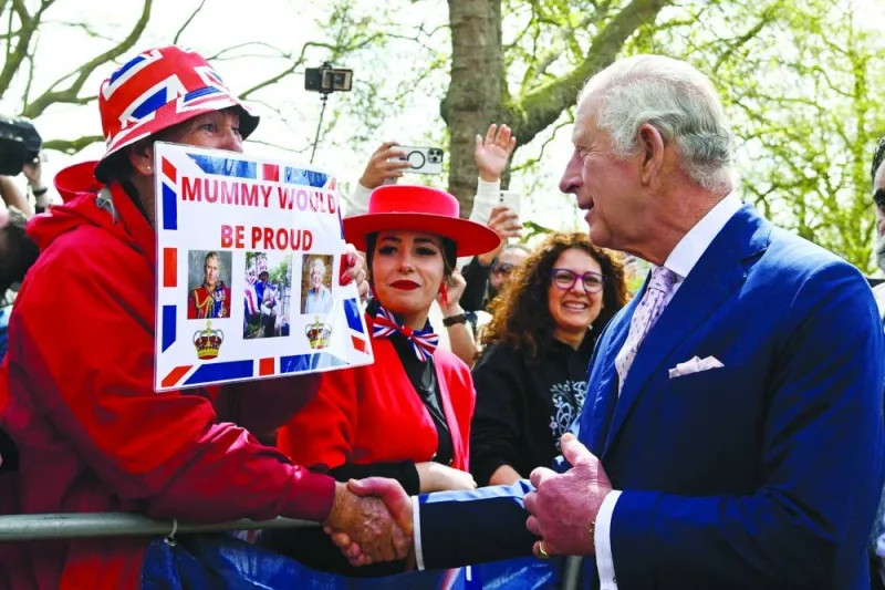 
King Charles meets well-wishers during a walkabout on the Mall outside Buckingham Palace ahead of his and Camilla, Queen Consort’s coronation, in London. 