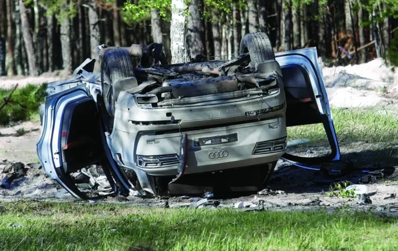A view shows a damaged white Audi Q7 car lying overturned on a track next to a wood, after Russian nationalist writer Zakhar Prilepin was allegedly wounded in a bomb attack in a village in the Nizhny Novgorod region, yesterday. (Reuters)