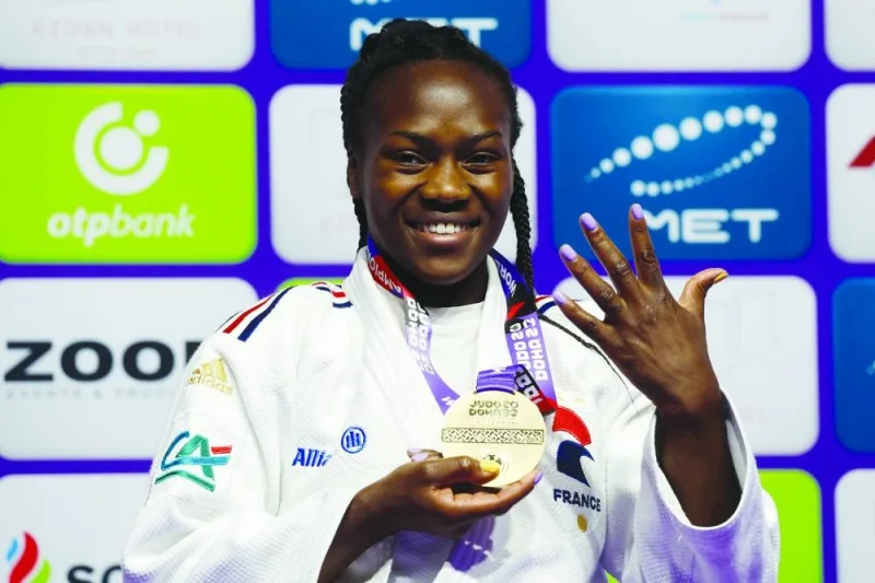 France’s Clarisse Agbegnenou celebrates on the podium after winning the women’s -63kg category gold medal at the World Judo Championship Doha 2023 on Wednesday. (AFP)