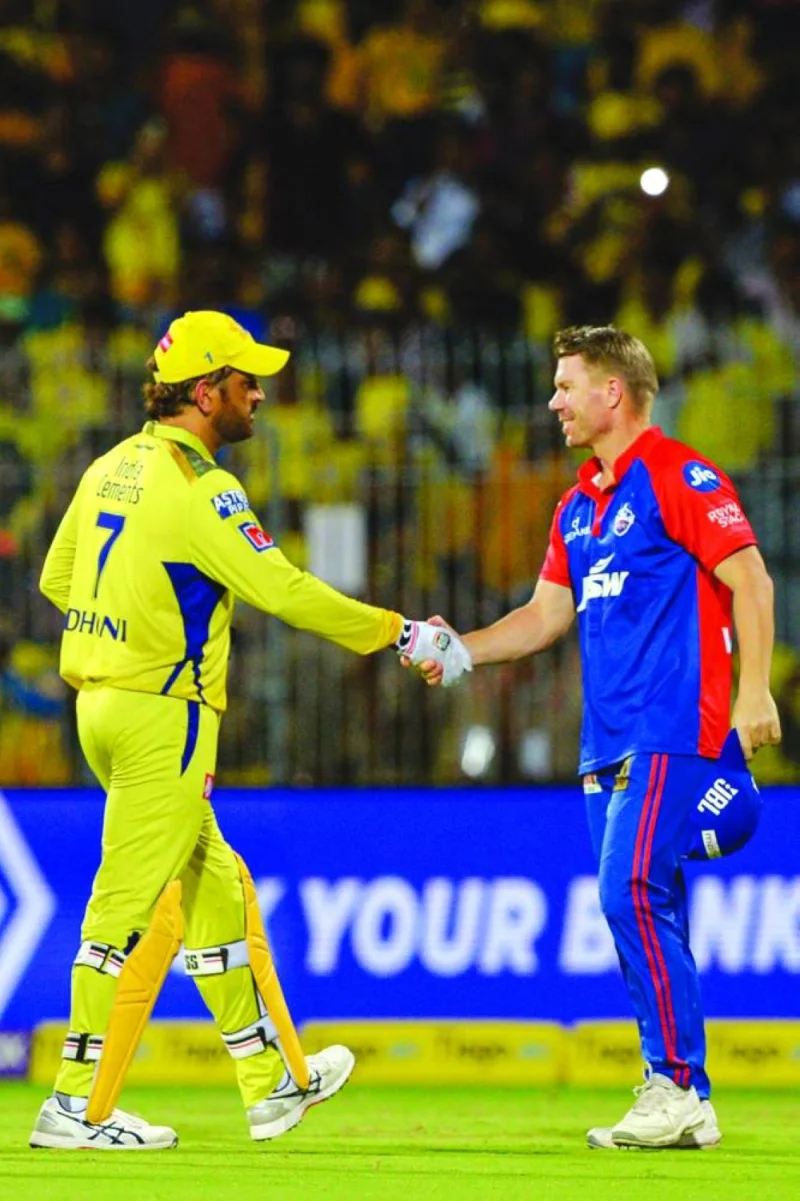 
Chennai Super Kings’ Mahendra Singh Dhoni (left) shakes hands with Delhi Capitals’ David Warner at the end of the IPL match in Chennai on Tuesday. (AFP) 