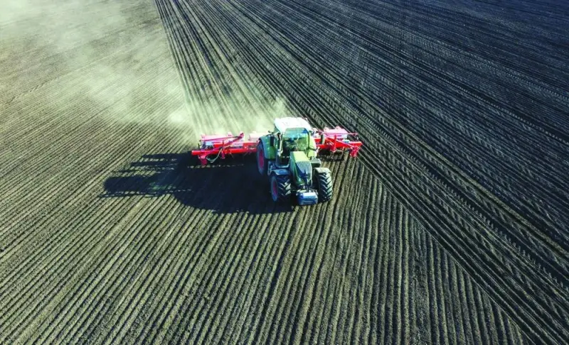 
An aerial view shows a tractor sowing corn seeds in a field near the village of Chaltyr in the Rostov region, Russia. 