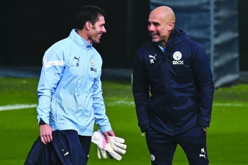 
Manchester City’s Spanish manager Pep Guardiola (right) and goalkeeping coach Xabier Mancisidor during a training session in Manchester yesterday, on the eve of their UEFA Champions League semi-final second leg match against Real Madrid. (Reuters) 