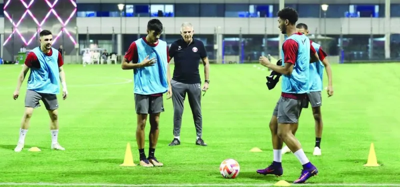 
Qatar’s coach Carlos Queiroz (centre) keeps a close eye on his players during a training camp at the Aspire Zone.
 