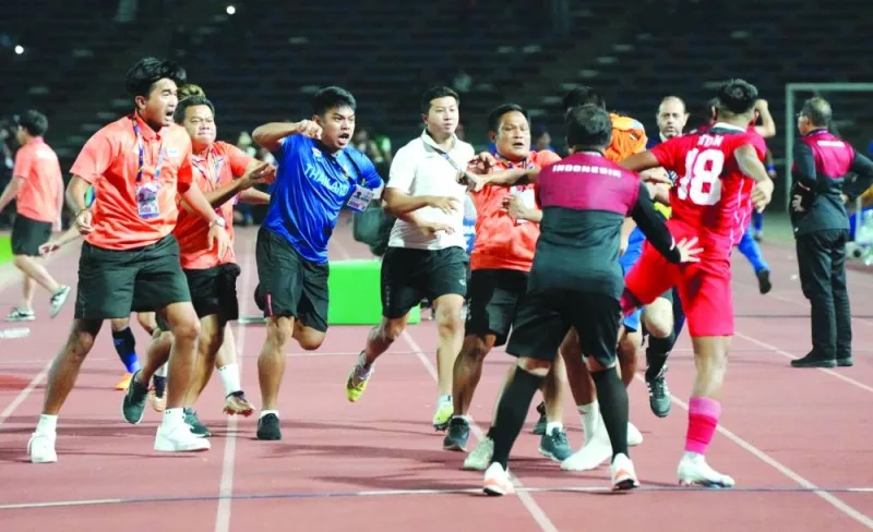 
Thailand and Indonesian players and coaching staff clash during the football final of the Southeast Asian Games Football in Phnom Penh, Cambodia, on Tuesday. (Reuters) 
