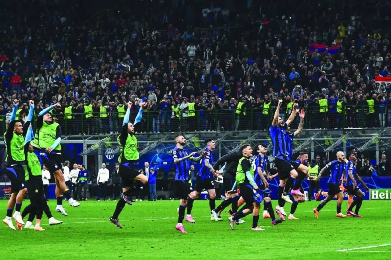 
Inter Milan players celebrate in front of their fans after winning the Champions League semi-final against AC Milan at the San Siro Stadium in Milan on Tuesday. (AFP) 