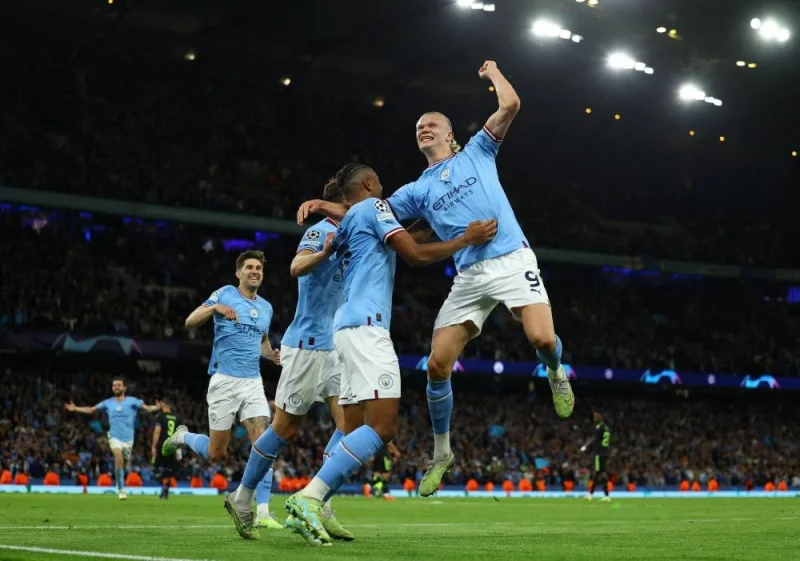 Manchester City&#039;s John Stones, Erling Braut Haaland, Manuel Akanji and Ruben Dias celebrate their third goal an own goal scored by Real Madrid&#039;s Eder Militao, on Wednesday. (Reuters)