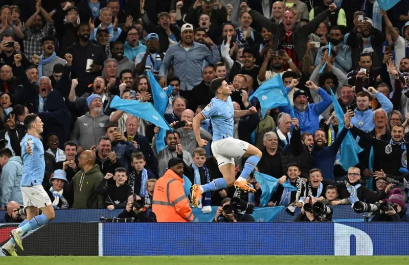 Manchester City&#039;s Argentinian striker Julian Alvarez (right) celebrates scoring the team&#039;s fourth goal with Manchester City&#039;s English midfielder Phil Foden during the UEFA Champions League second leg semi-final football match between Manchester City and Real Madrid at the Etihad Stadium in Manchester, north west England, on Wednesday. (AFP)
