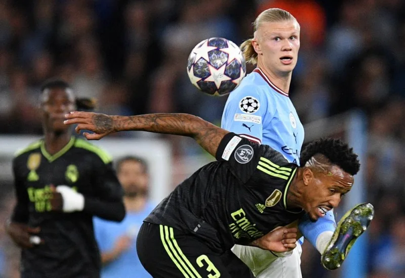 Real Madrid&#039;s Brazilian defender Eder Militao (right) vies with Manchester City&#039;s Norwegian striker Erling Haaland during the UEFA Champions League second leg semi-final football match between Manchester City and Real Madrid at the Etihad Stadium in Manchester, north west England, on Wednesday, (AFP)