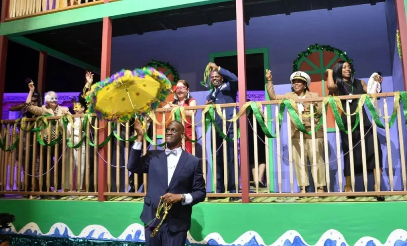 US ambassador Timmy T Davis joins performers on a parade float that entertained the crowd.