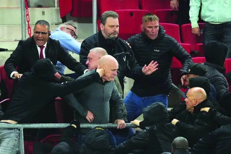 
Supporters of AZ Alkmaar and West Ham United clash in the stands after the UEFA Conference League semi-final match. (AFP) 