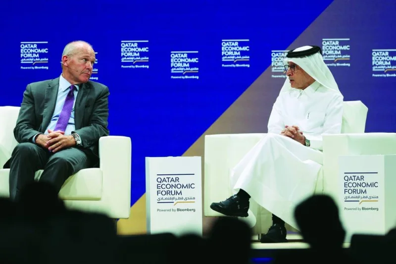 Dave Calhoun, chief executive officer of Boeing Co, left, and HE Akbar al-Baker, chief executive officer of Qatar Airways, during a panel session at the Qatar Economic Forum (QEF) in Doha, Tuesday.