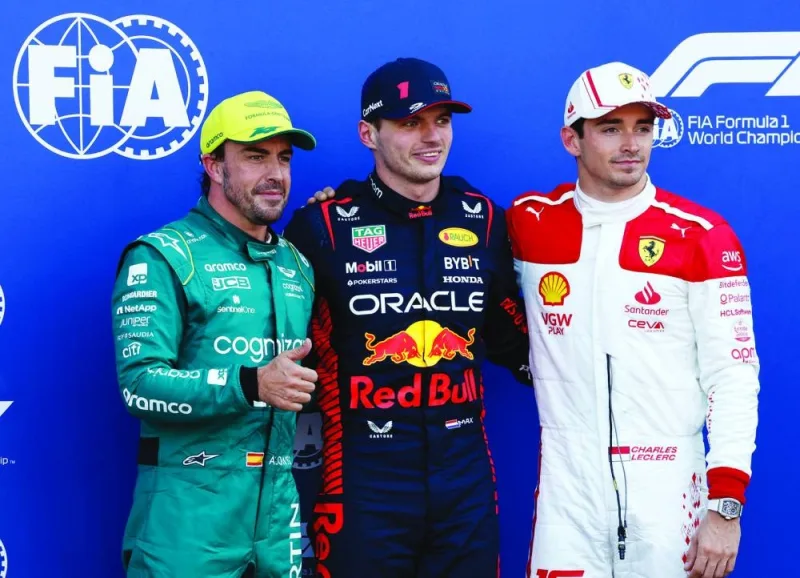 Red Bull’s Max Verstappen (centre) celebrates after qualifying in pole position alongside second-placed Aston Martin’s Fernando Alonso (left) and Charles Leclerc at the Monaco Grand Prix in Monte Carlo on Saturday. (Reuters)