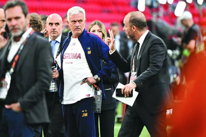 Roma’s coach Jose Mourinho (centre) reacts as he inspects the pitch on the eve of the UEFA Europa League final against Sevilla at the Puskas Arena in Budapest, Hungary, on Tuesday. (AFP)