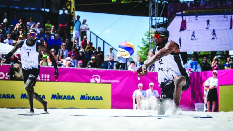 
Qatar’s Cherif Younousse and Ahmed Tijan in action at the Volleyball Beach Pro Elite16 event in Ostrava, Czech Republic. 