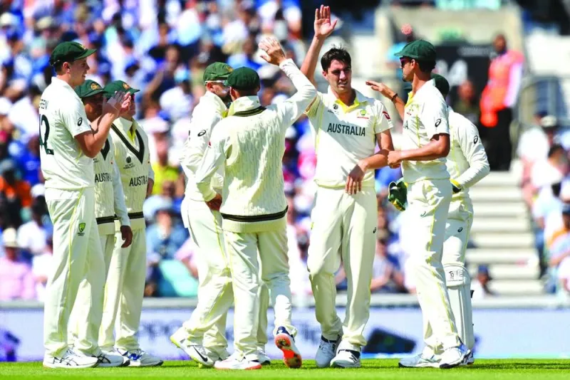 Australia’s Pat Cummins (third right) celebrates after dismissing India’s captain Rohit Sharma (not in the picture) with teammates during 
Day 2 of the World Test Championship final at The Oval in London on Thursday. (AFP)