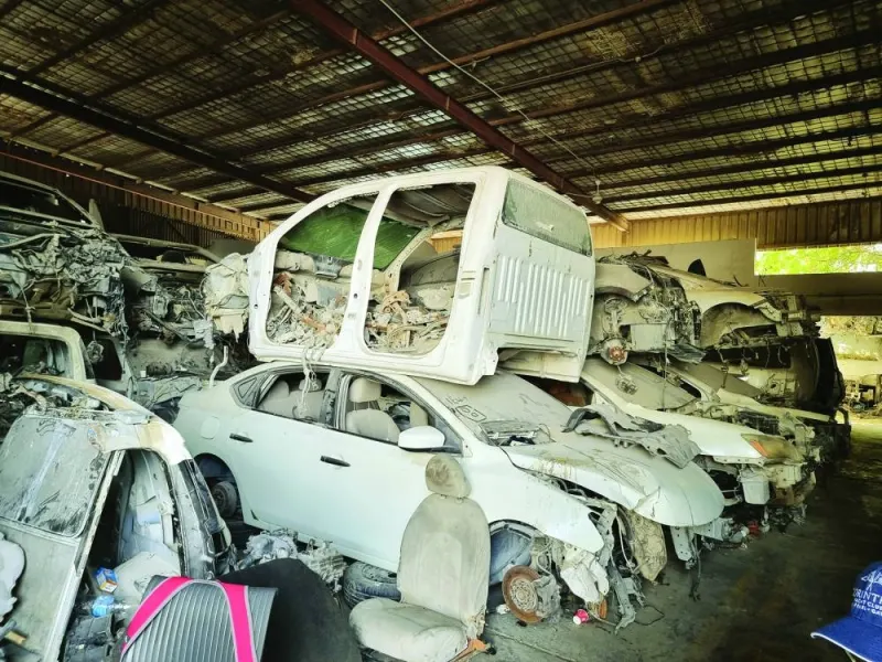 Garages in Qatar collect junked cars, which can be a valuable source of spare parts. PICTURE: Joey Aguilar