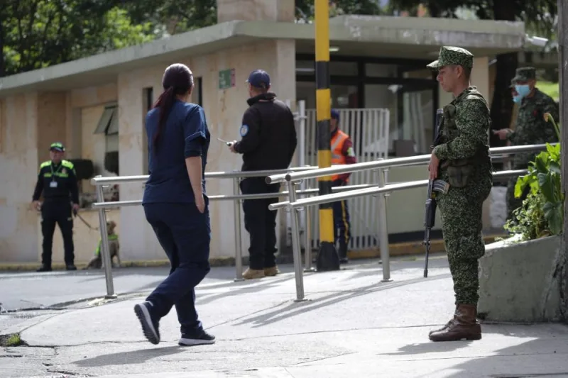 Soldiers and police guard the entrance of the Military Hospital, where the four indigenous children who were found alive after being lost for 40 days in the Colombian Amazon rainforest following a plane crash were hospitalized in Bogota on June 10, 2023. Juan Pablo Pino / AFP