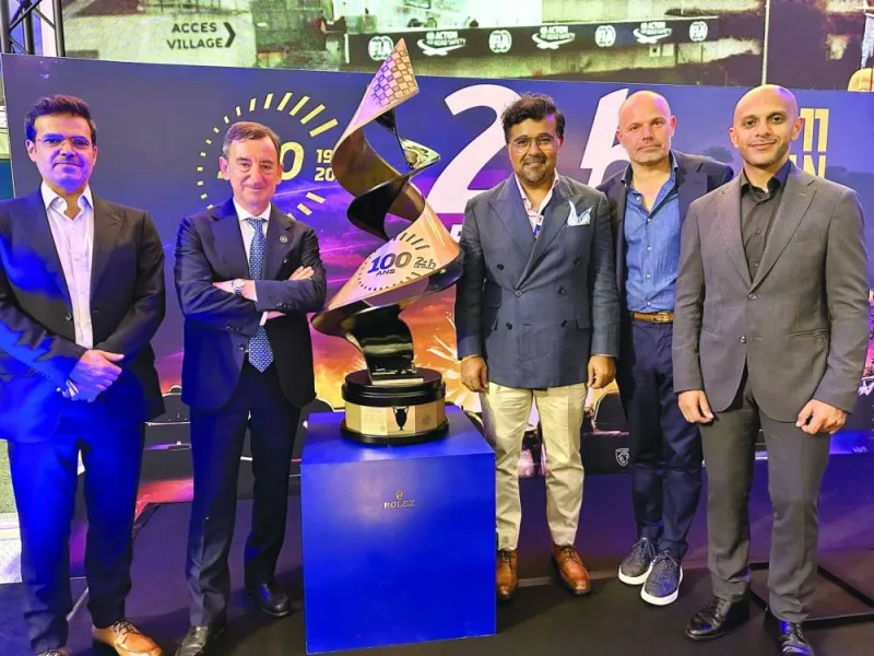 
Qatar Motor & Motorcycle Federation president Abdul Rahman bin Abdullatif al-Mannai (centre), QMMF Executive Director and CEO of Lusail International Circuit Amro al-Hamad (right), FIA WEC CEO Frederic Lequien (second right) and other officials pose after a press conference in Paris. 