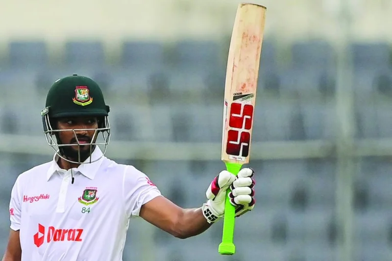 Bangladesh’s Najmul Hossain Shanto celebrates after scoring a half-century during the second day of the Test against Afghanistan in Dhaka on Thursday. (AFP)