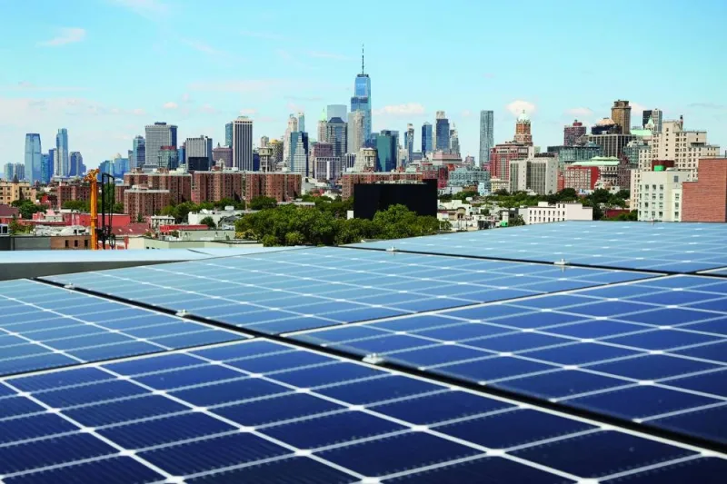 
Solar panels are seen along with a view of the neighbourhood and lower Manhattan from the rooftop of Timber House, the city’s first mass-timber condo building, in the Park Slope neighbourhood of Brooklyn, New York, last year.  (Reuters) 